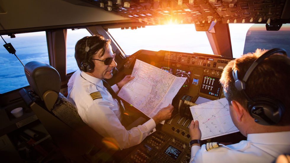 a group of pilots in a cockpit