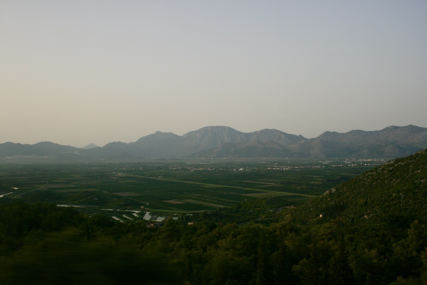 a landscape with mountains in the background