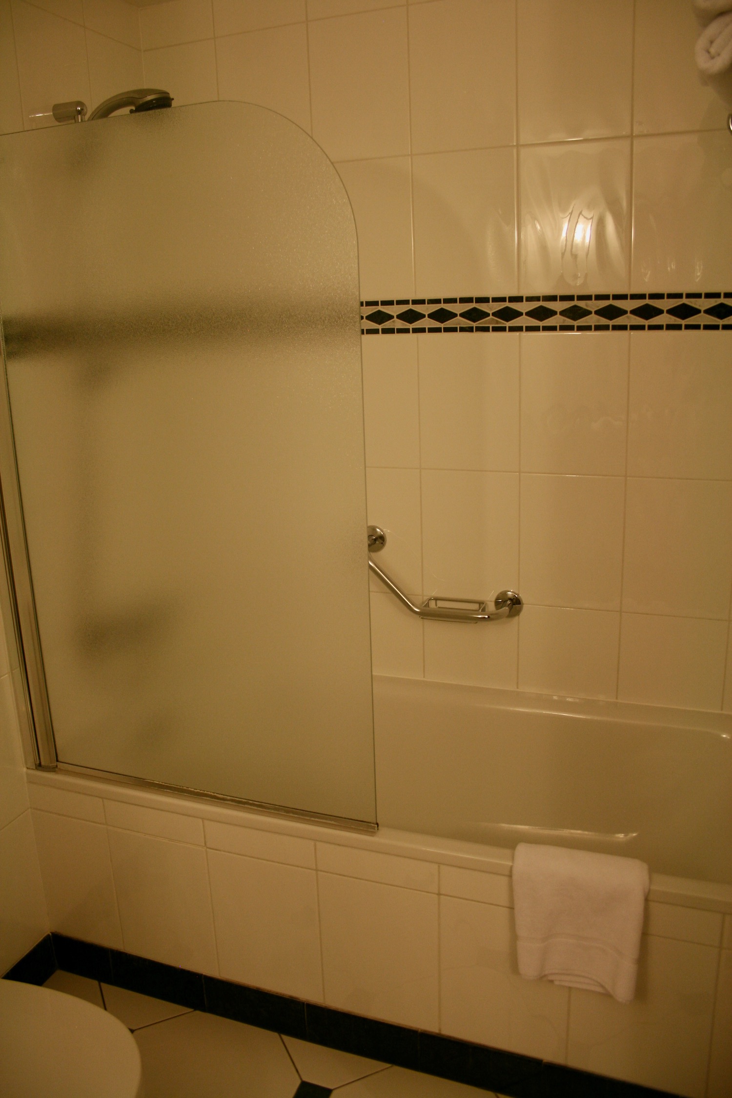 a bathroom with a glass door