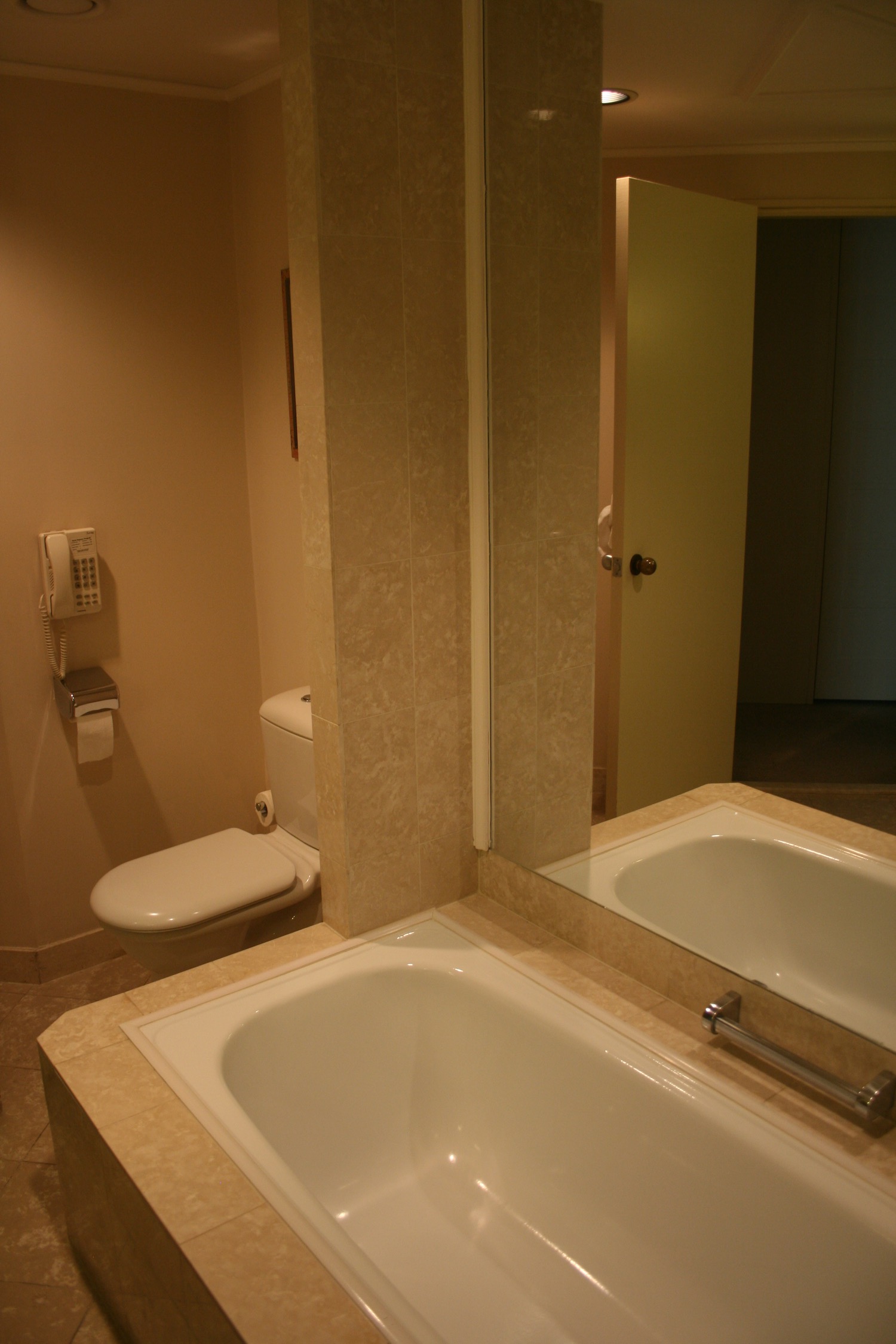 a bathroom with a bathtub and toilet