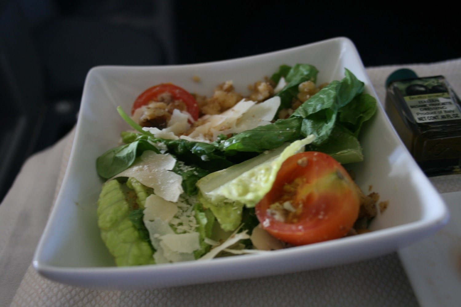 a salad in a square bowl