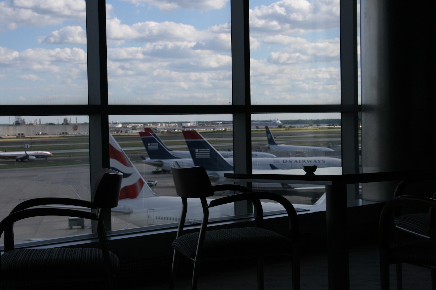 a window with airplanes in the background