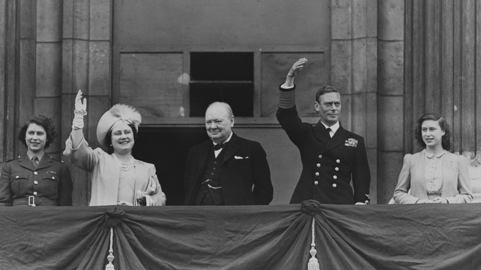 a group of people standing on a balcony