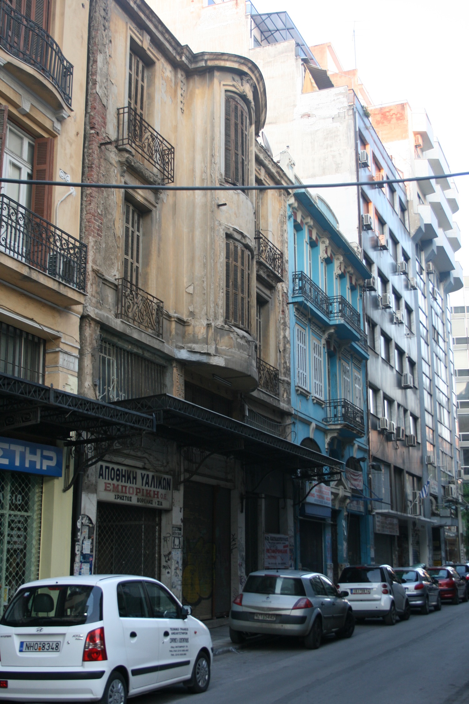 a street with cars and buildings