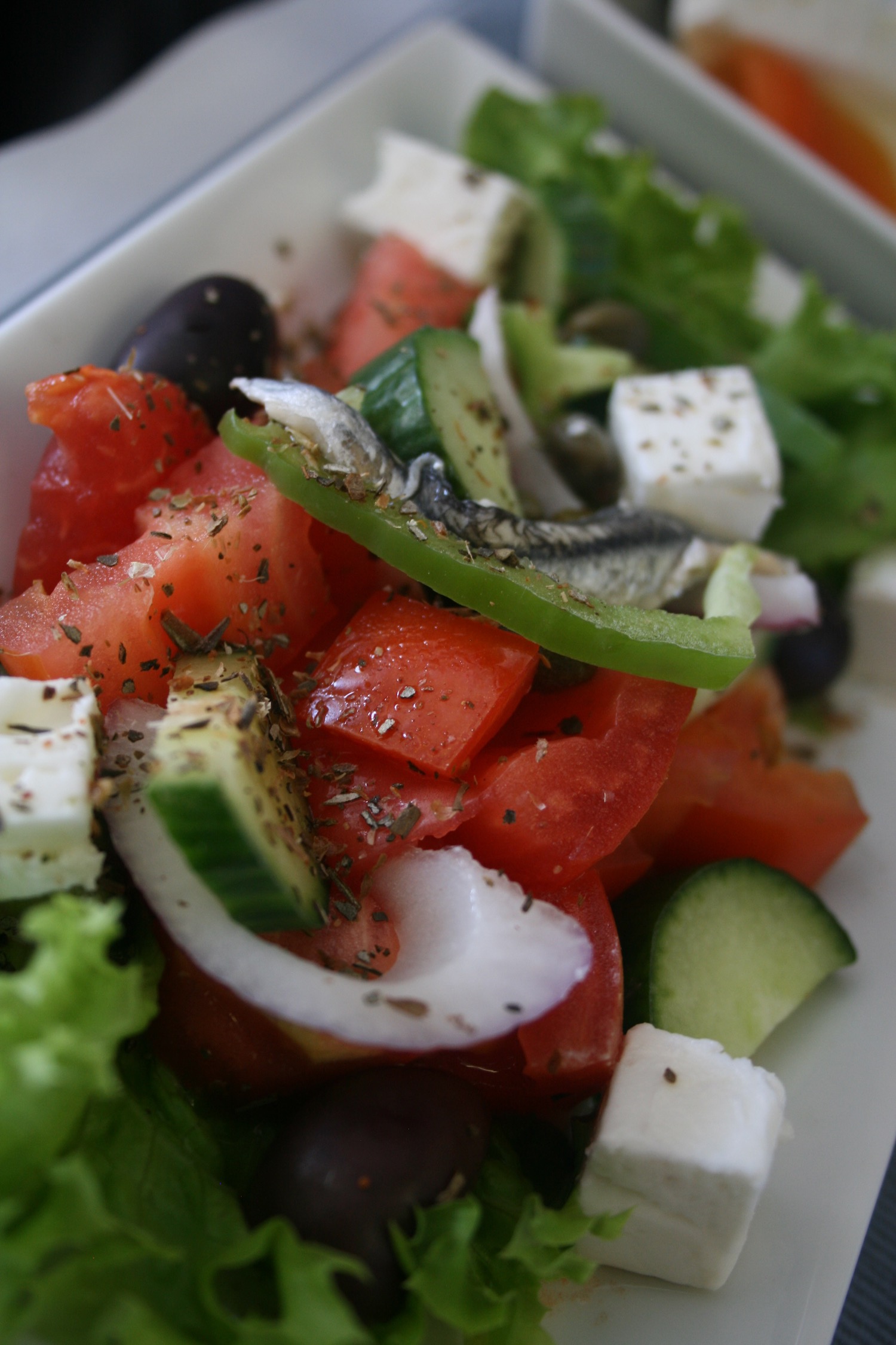 a salad with vegetables and anchovies