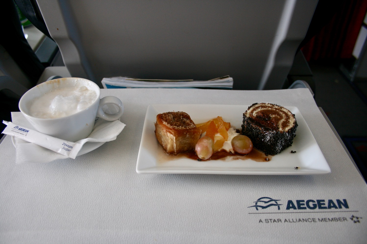 a plate of food and a cup of coffee on a table