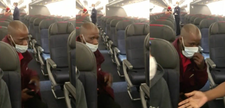 a man in a mask on a plane