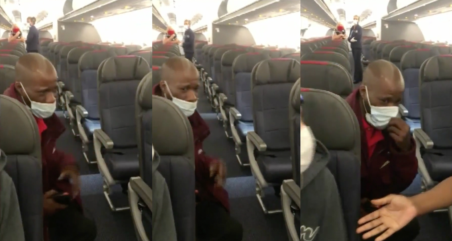 a man in a mask on a plane