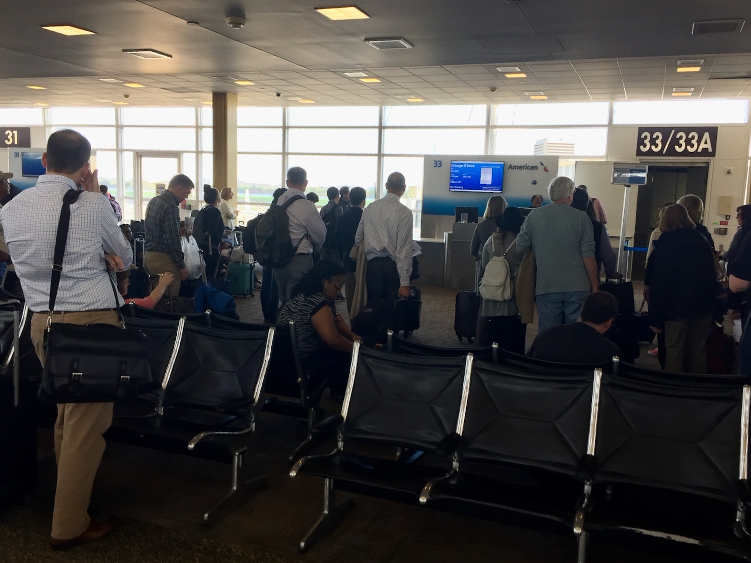 a group of people in an airport waiting area