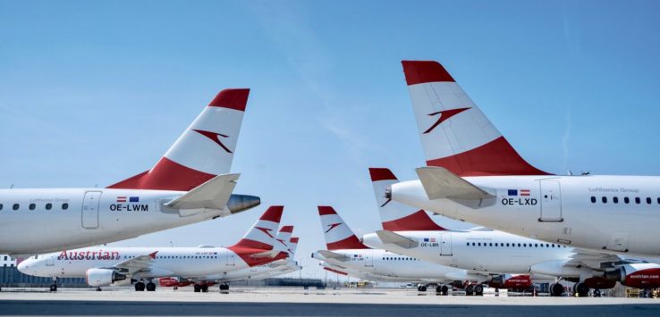 a group of airplanes parked on a runway