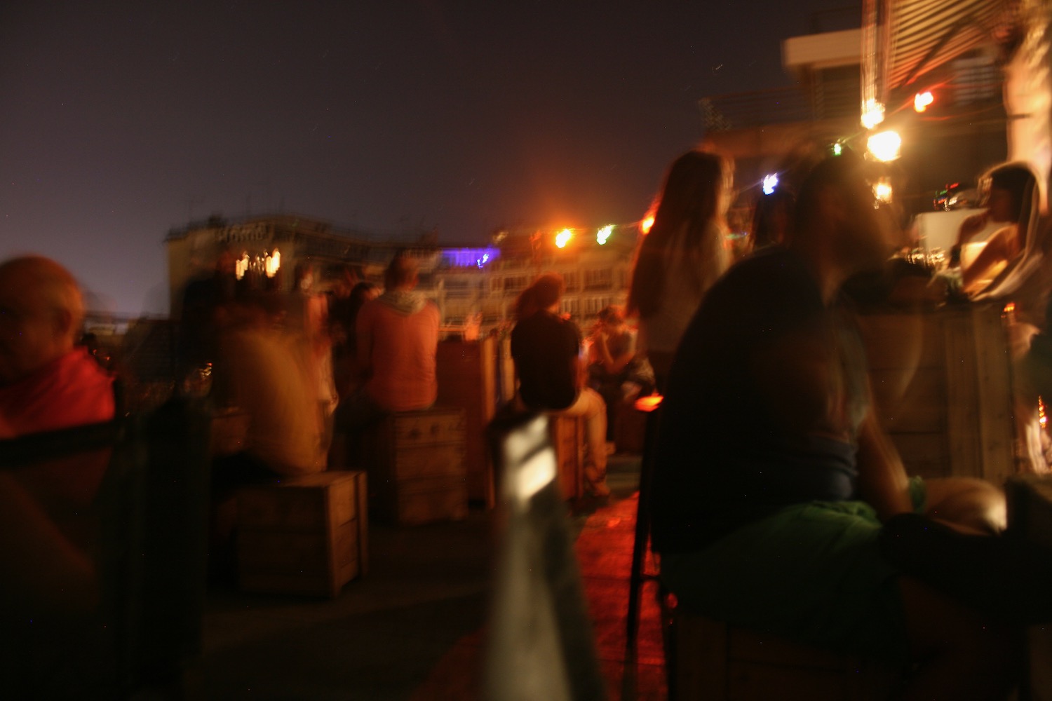 a group of people sitting on a patio