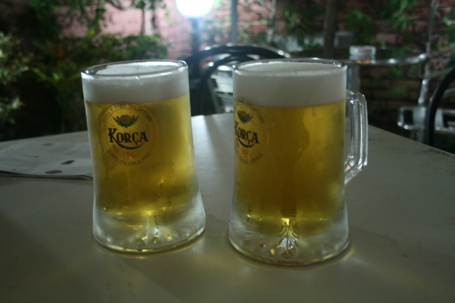 two glasses of beer on a table