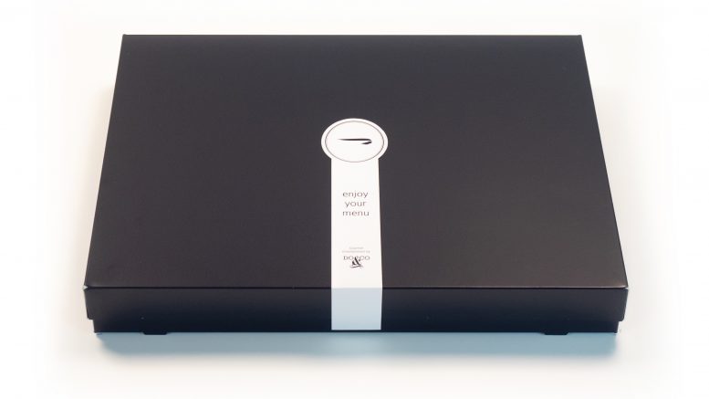 a black rectangular object with a white label