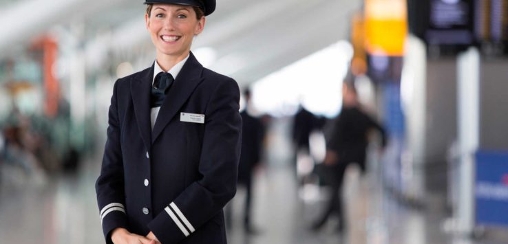 a woman in uniform smiling