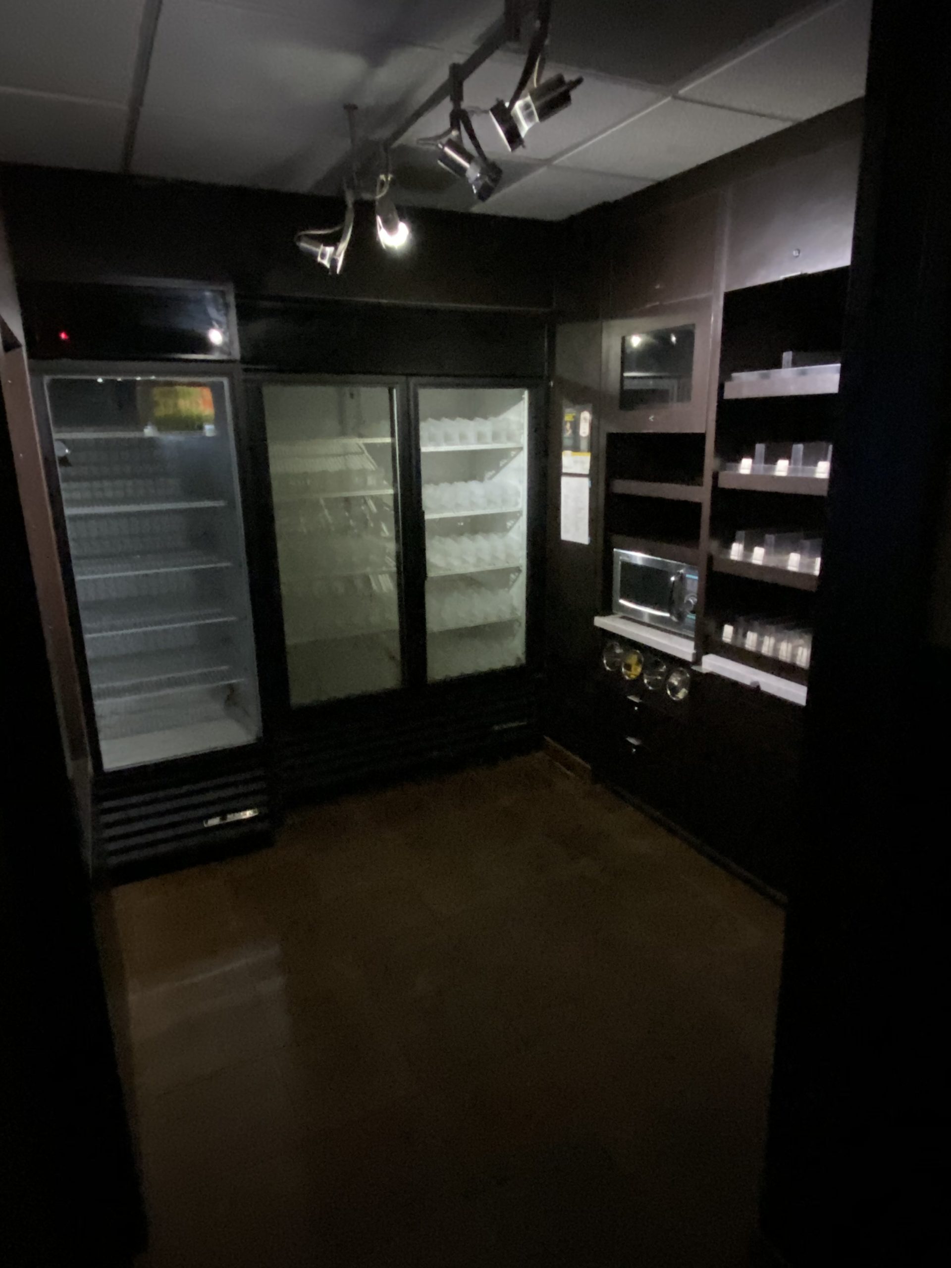 a refrigerator with shelves and lights