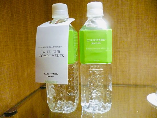 two bottles of water with a label