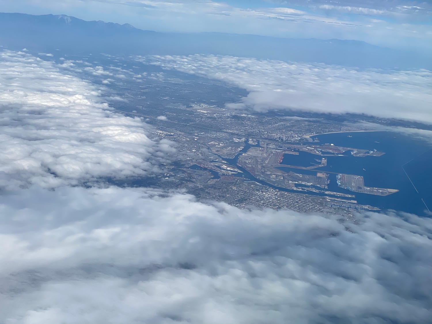 aerial view of a city and water from the sky