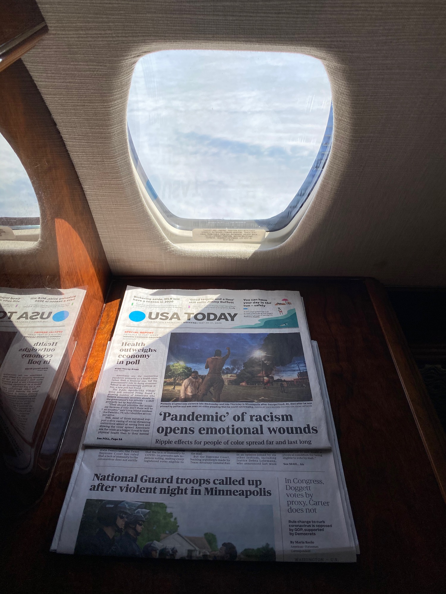 a newspaper on a table with windows