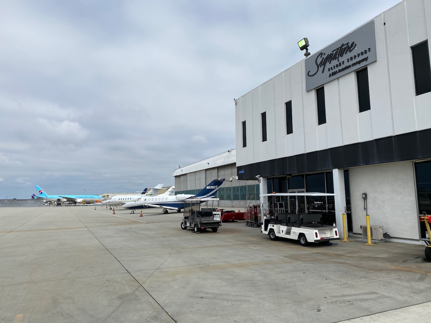 a group of airplanes parked outside of a building