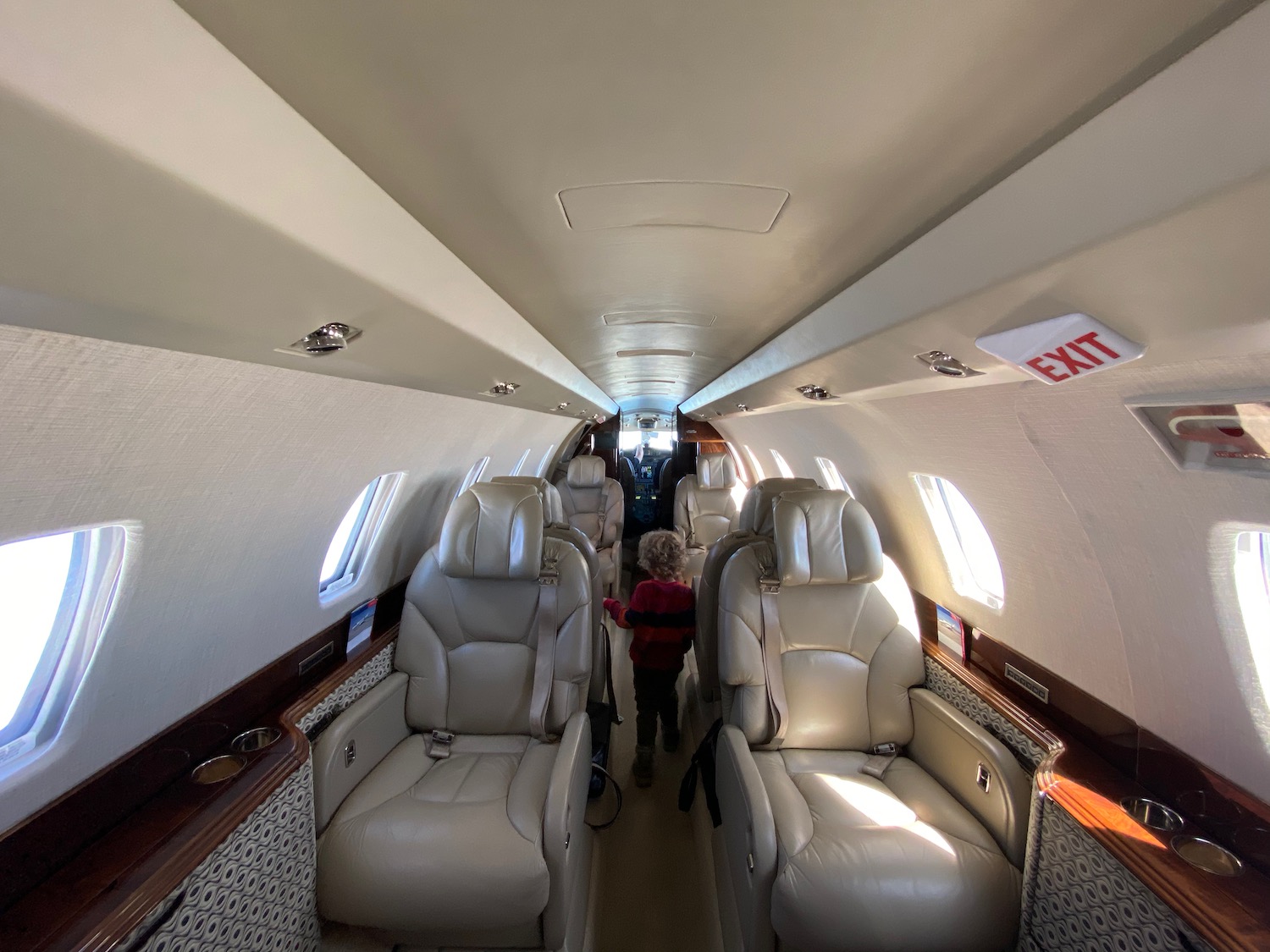 a child standing in the middle of a plane