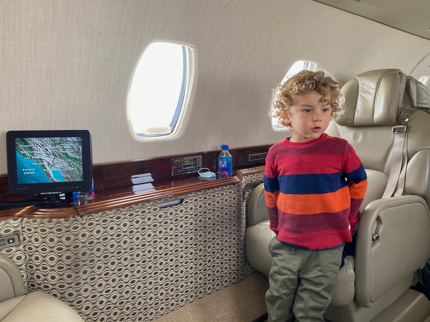 a child standing in an airplane