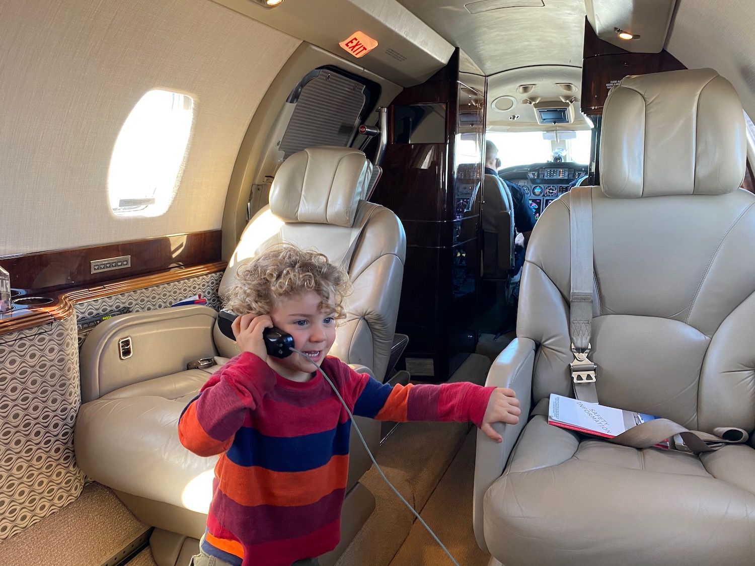 a child on the phone in a plane