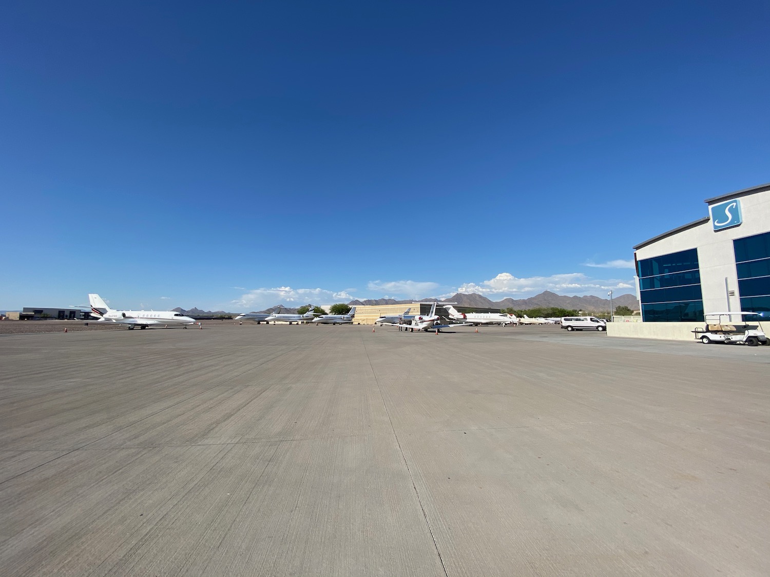 an airport with airplanes on the ground