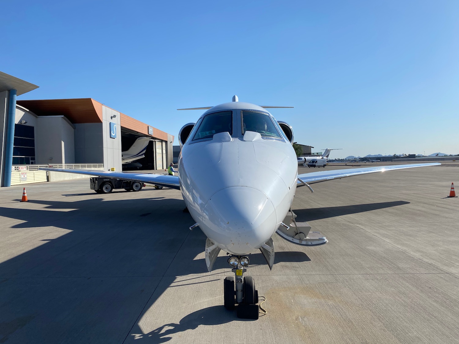 a white airplane on a runway