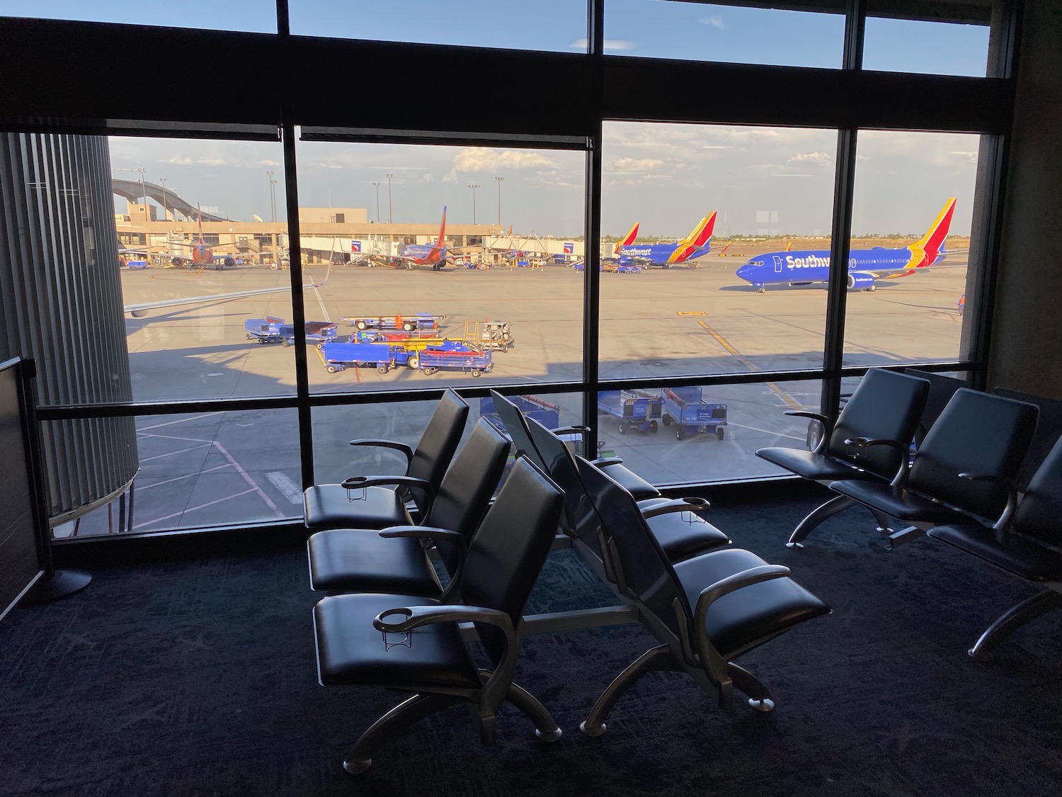 a row of chairs in an airport