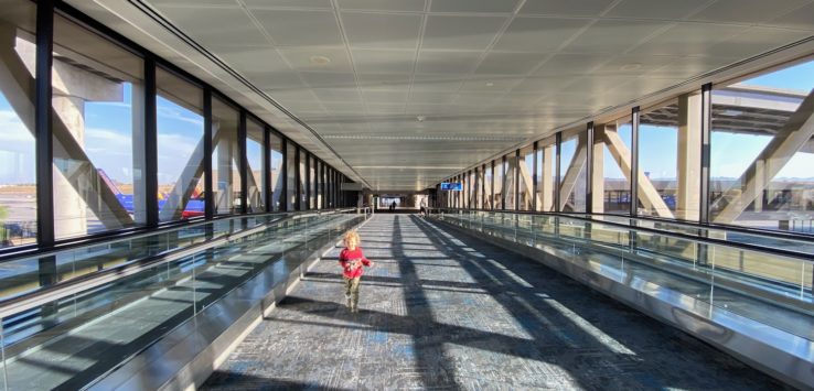 a child walking on an empty walkway