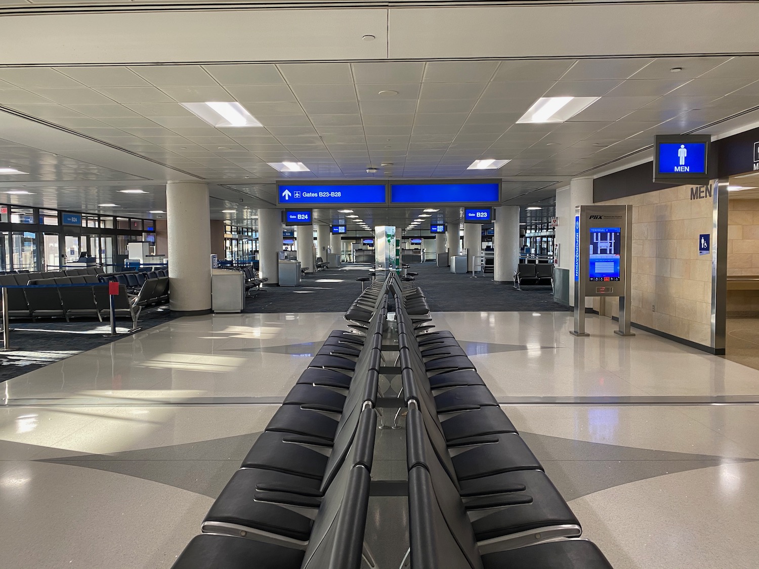 a row of chairs in an airport