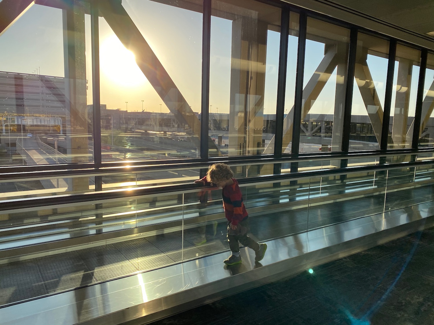 a child walking on an escalator
