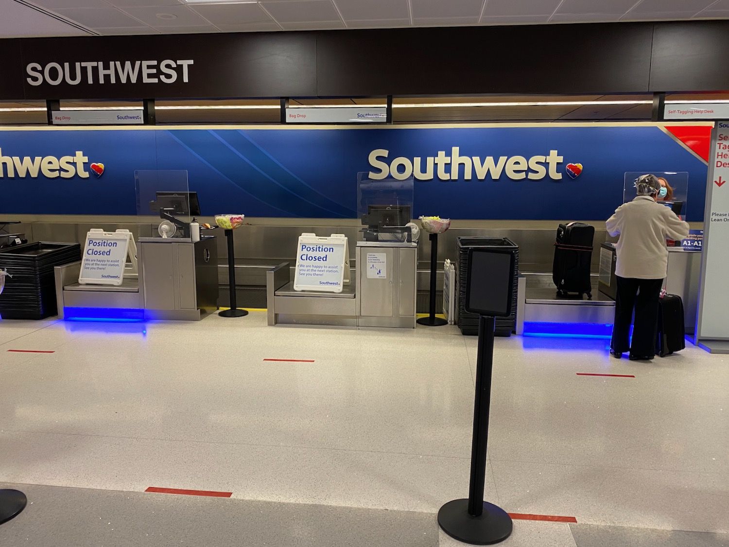 a person standing in front of a sign