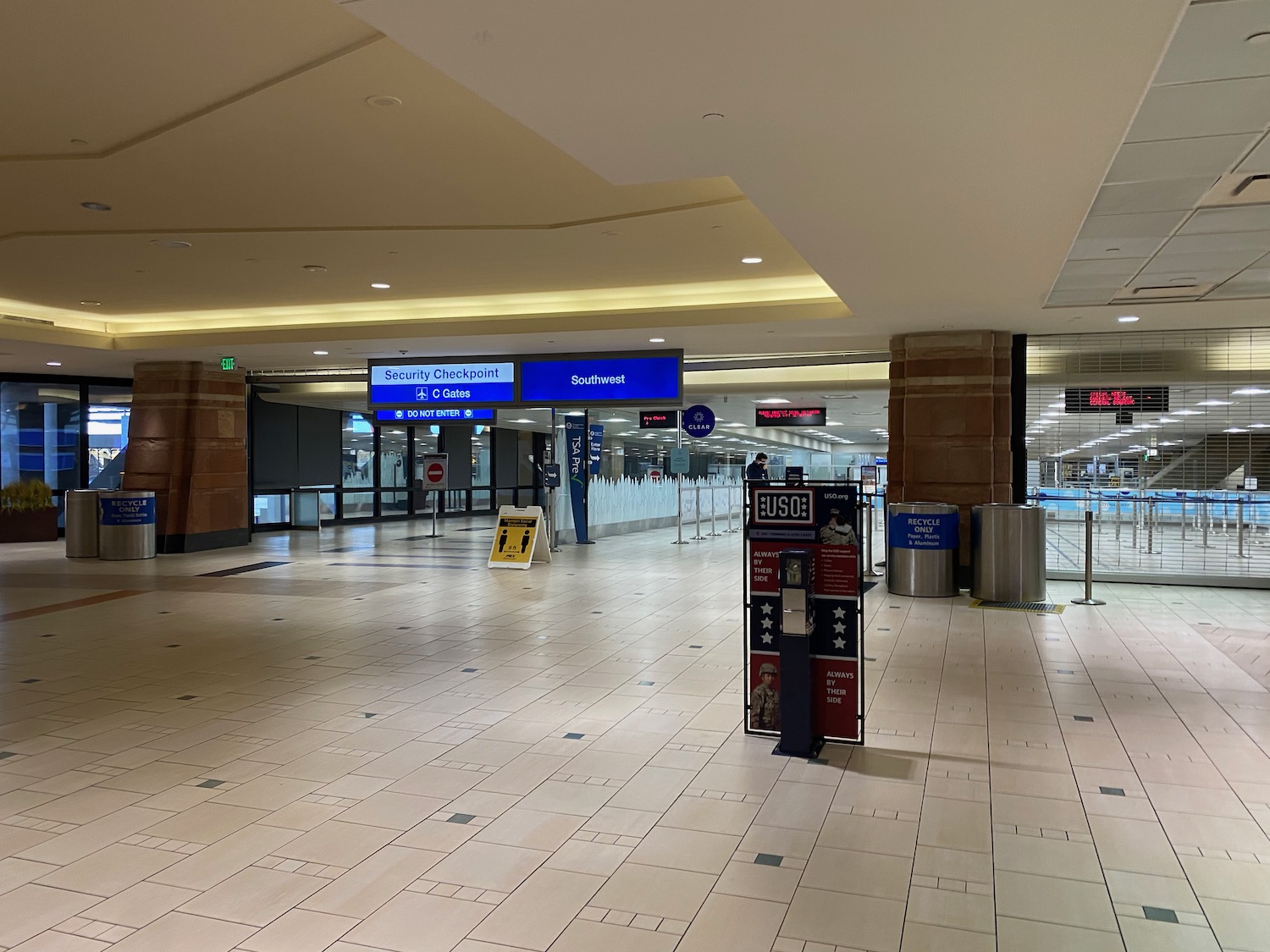 a large airport terminal with signs and signs