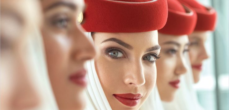 a group of women wearing red hats