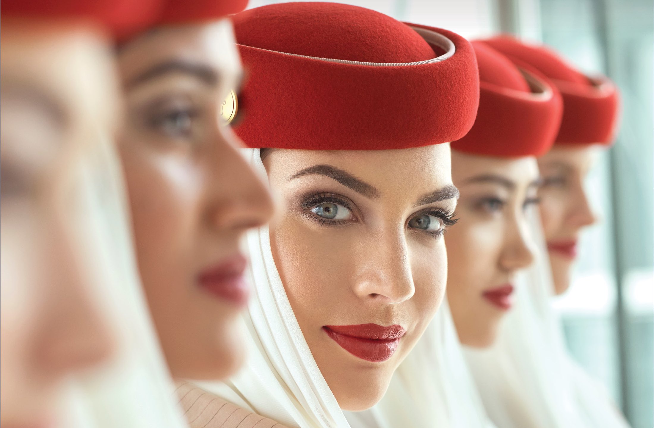 a group of women wearing red hats