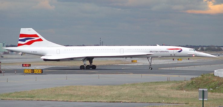 a large white airplane on a runway