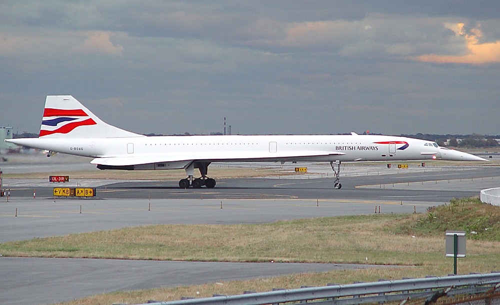 a large white airplane on a runway