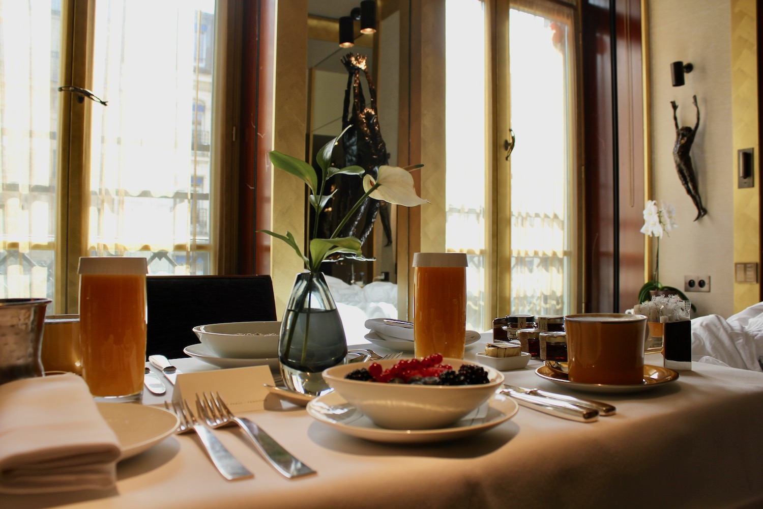 a table with plates and bowls of food