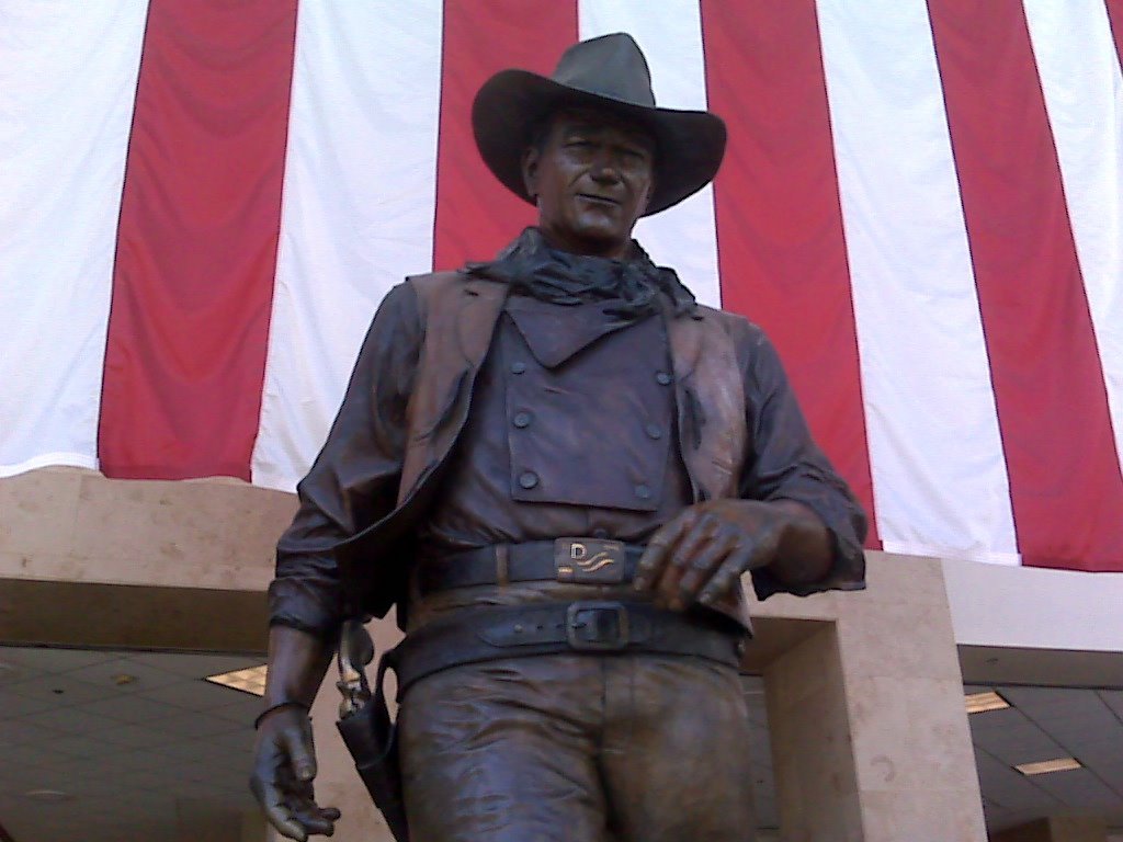 a statue of a man in a cowboy hat