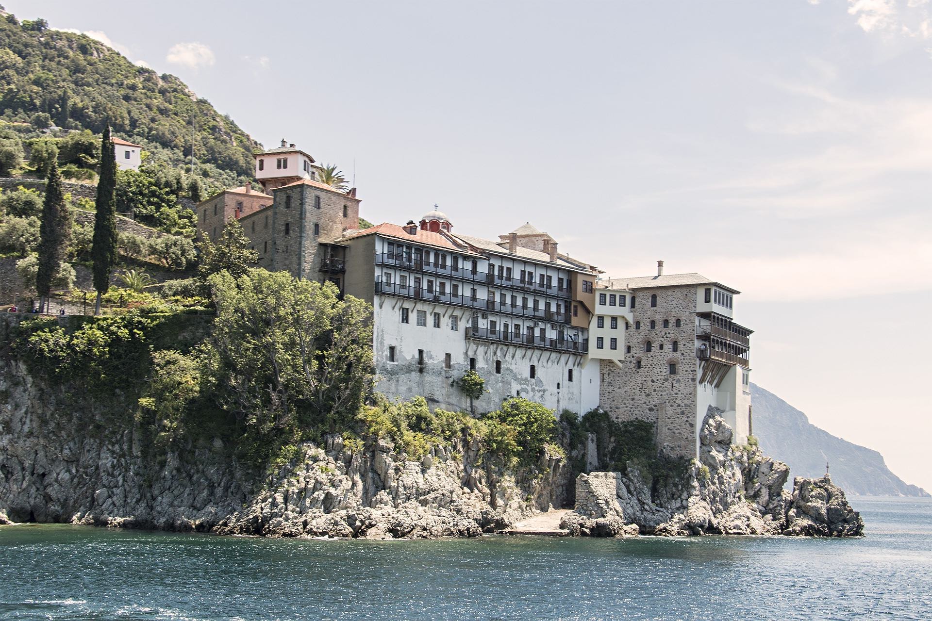 Mount Athos on a cliff by water
