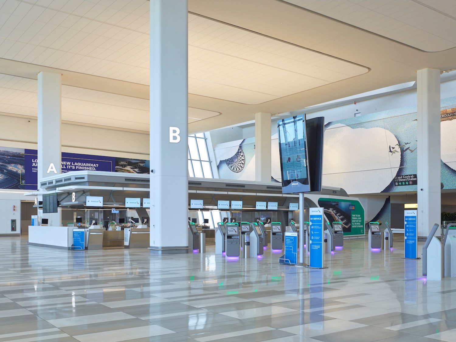 a large airport terminal with a check in counter