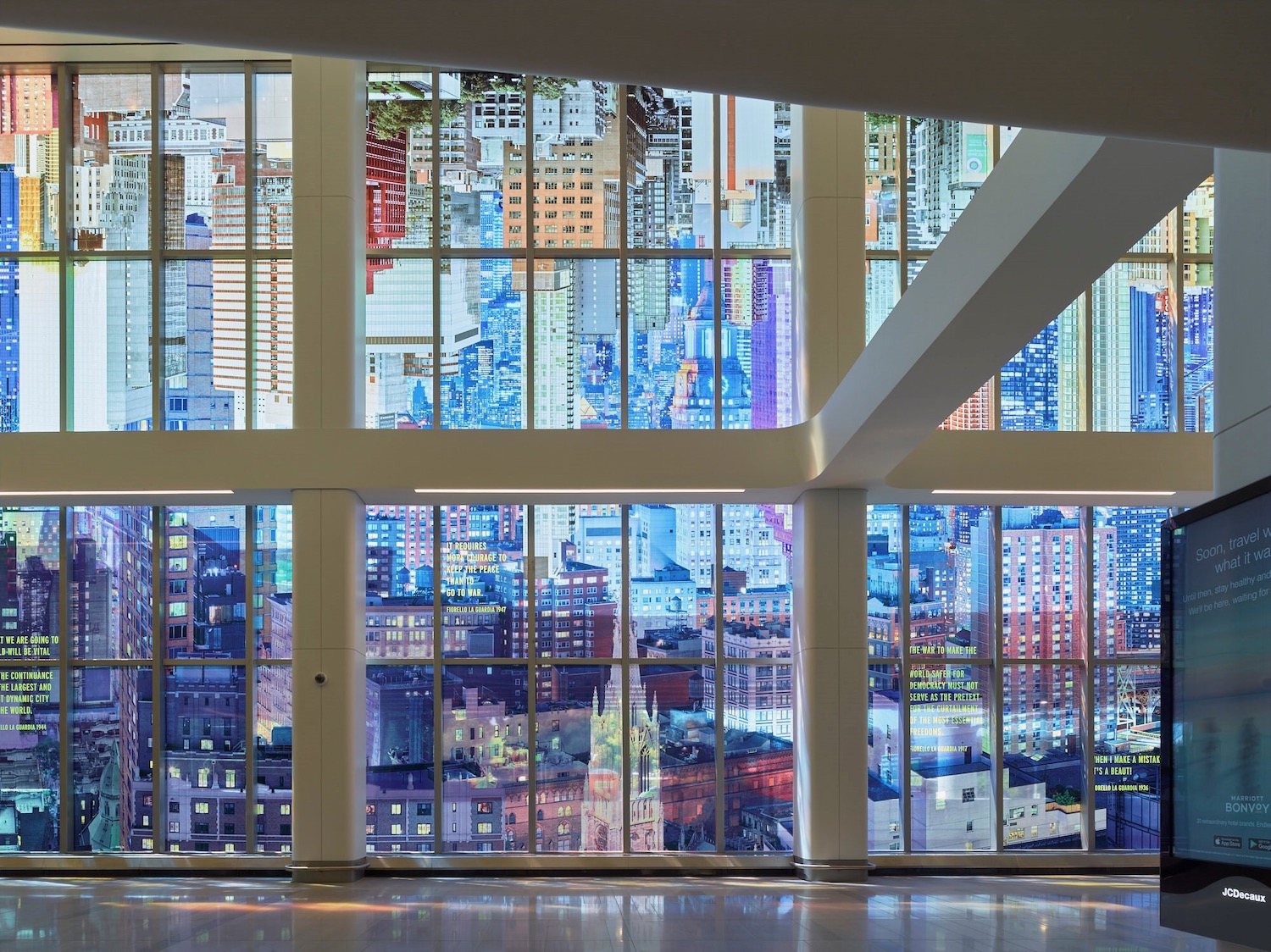 a large windows with a city view seen through them