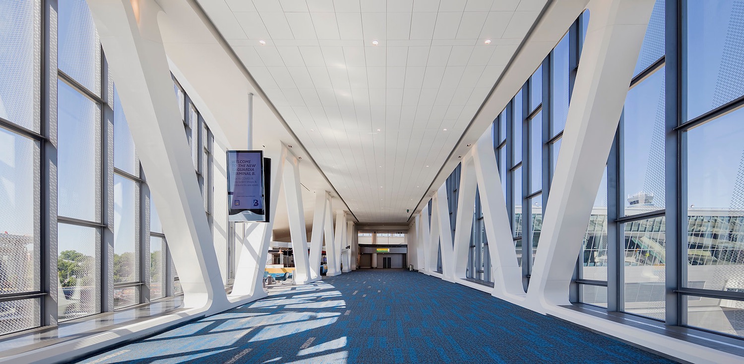 a large white and blue hallway with large windows