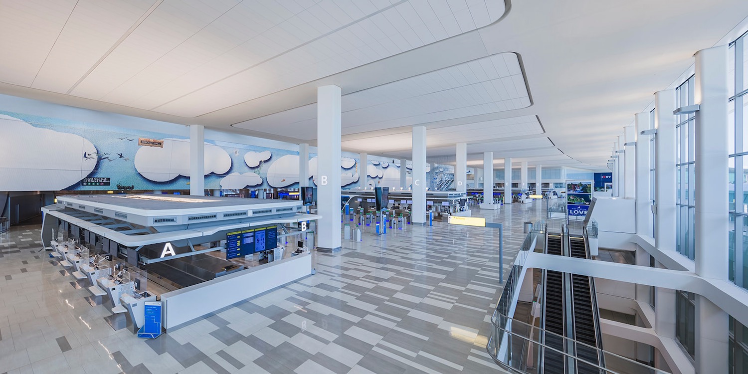 a large white building with a check-in counter