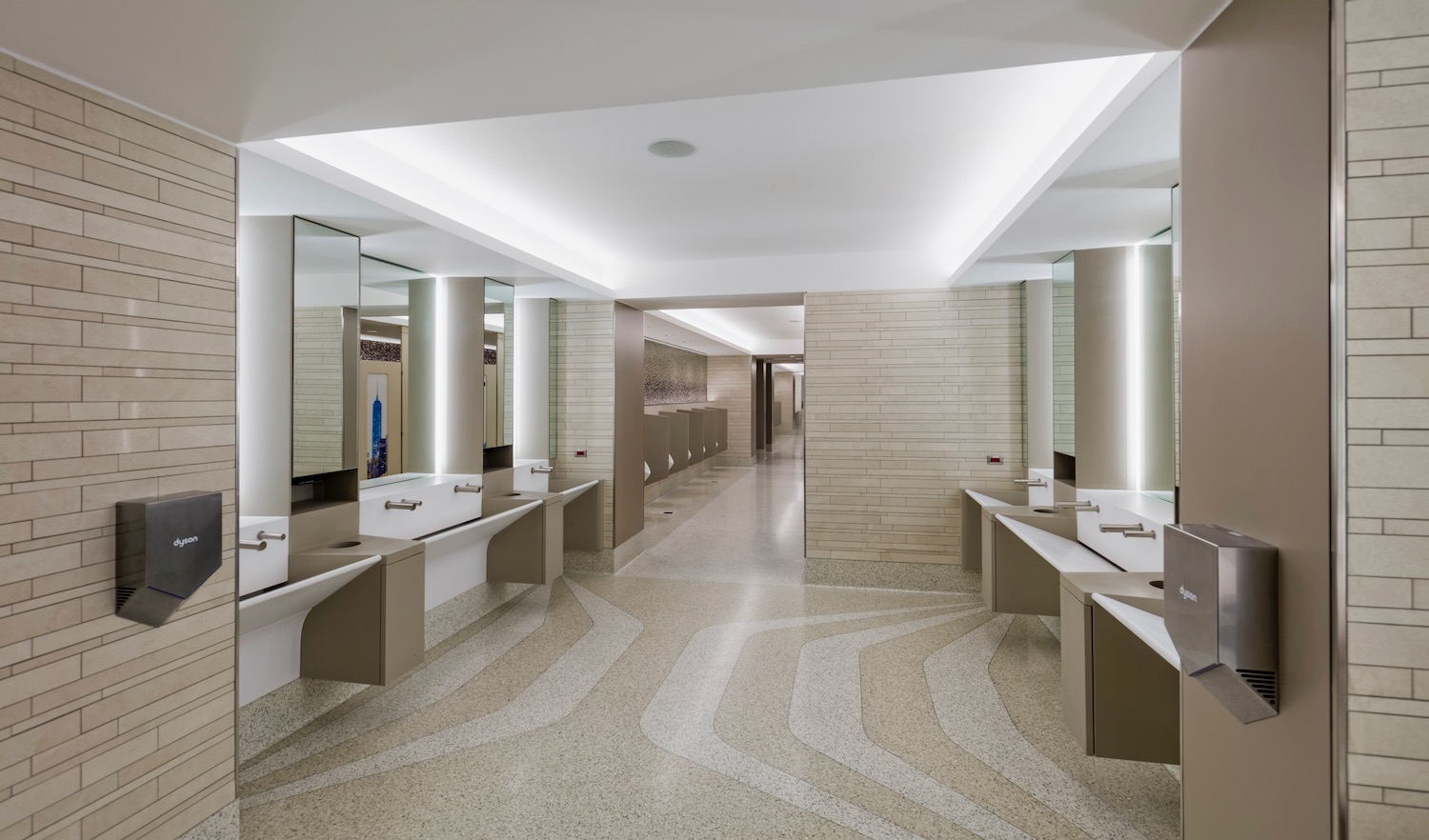 a bathroom with sinks and mirrors