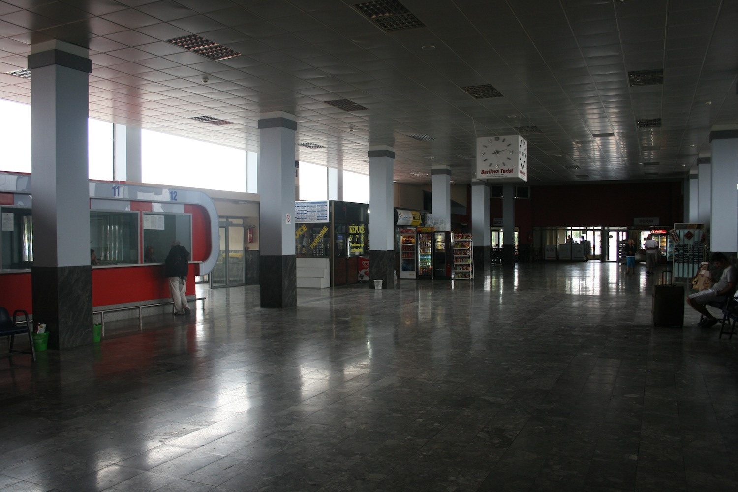 a large empty building with a large window