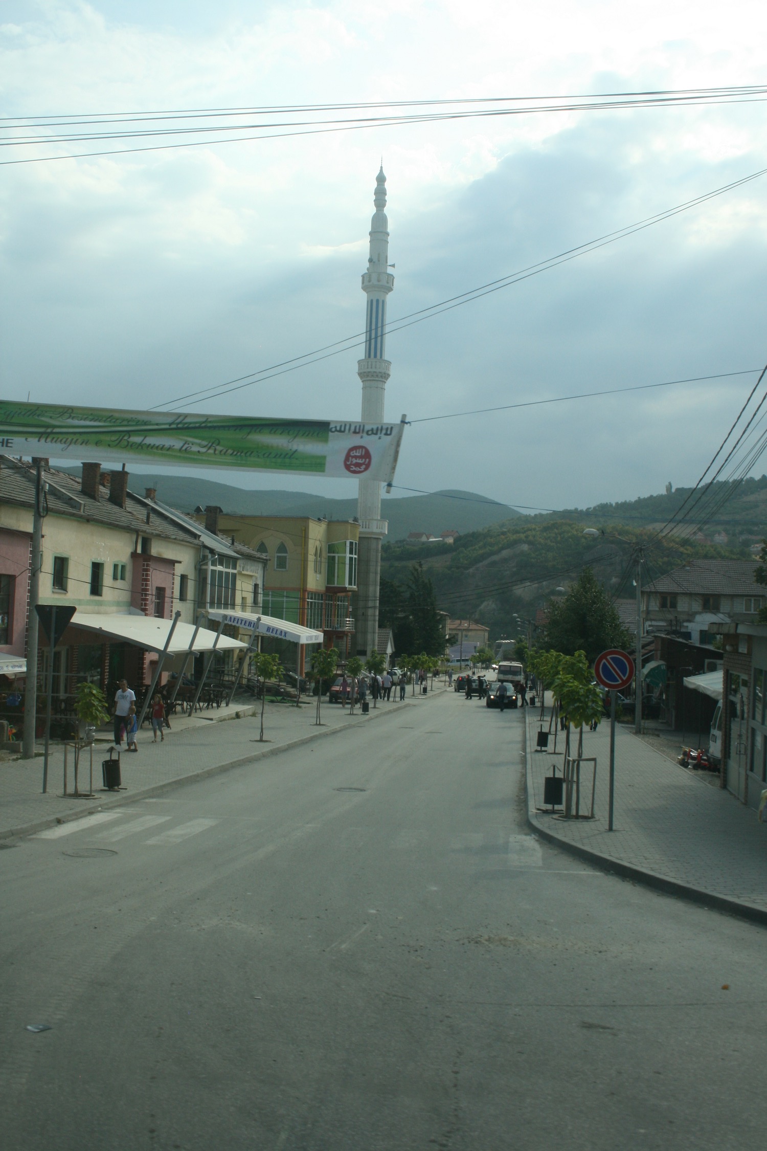 a street with buildings and a tall tower