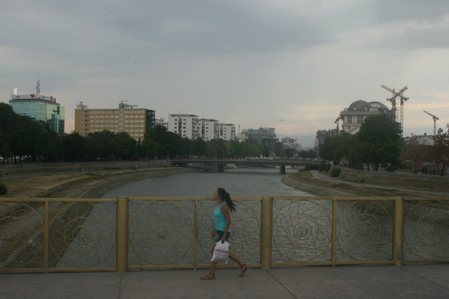 a woman walking on a bridge