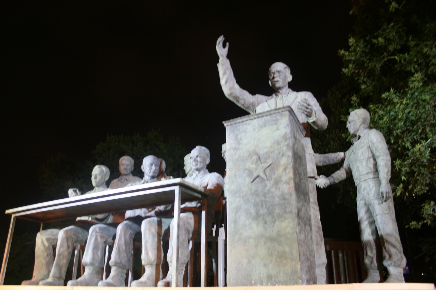 a statue of a man at a podium